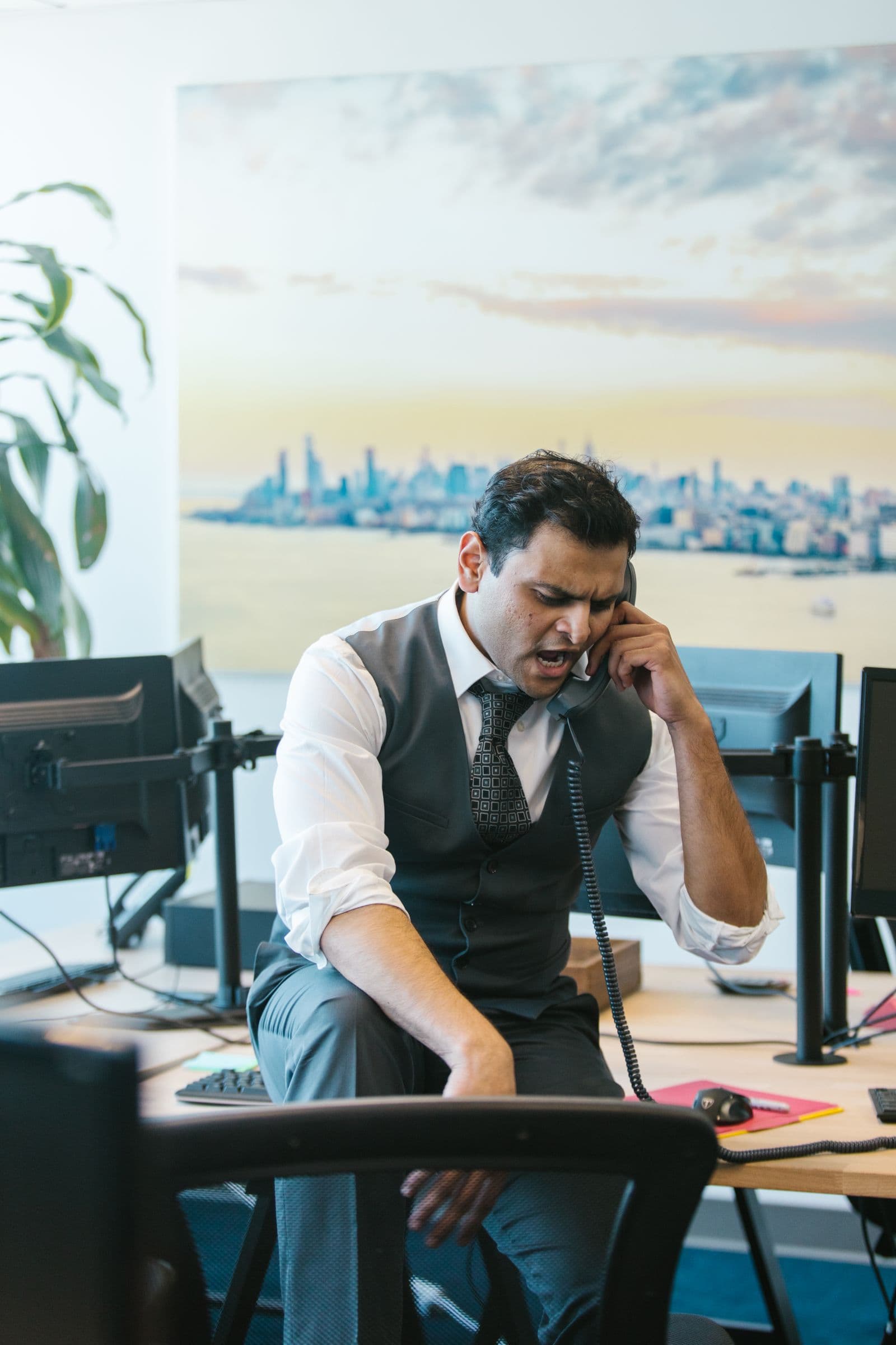A frustrated customer on the phone, waiting for an answer